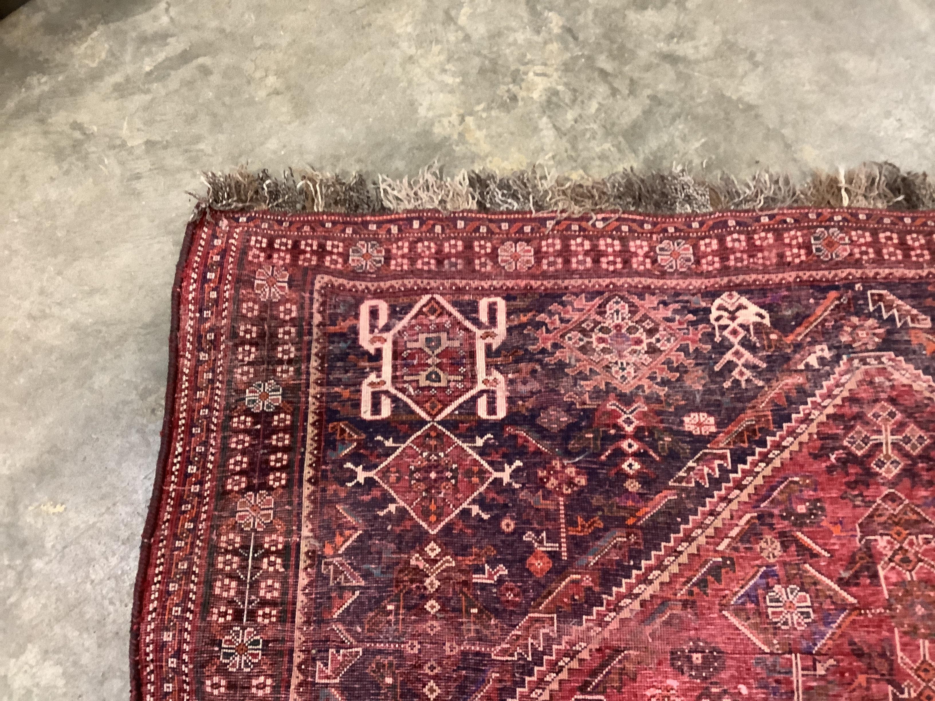 A North West Persian red ground carpet, 264 x 165cm
